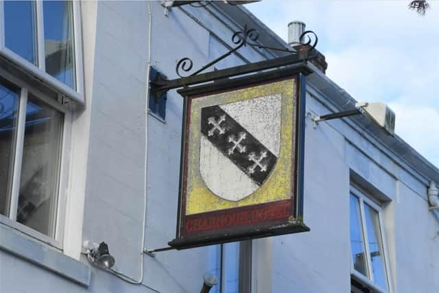 The old Charnock Hotel pub sign still remains.