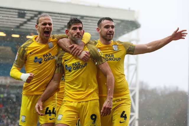 Preston North End's Ched Evans celebrates scoring against Blackburn with Brad Potts (left) and Ben Whiteman (right)