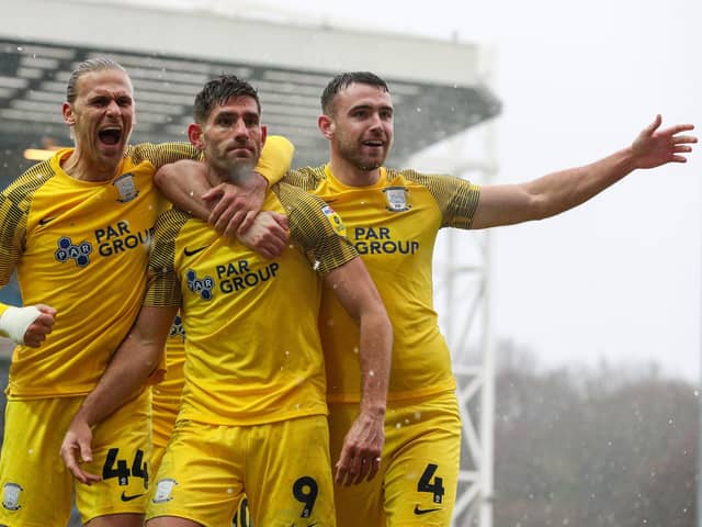 Preston North End's Ched Evans celebrates scoring against Blackburn with Brad Potts (left) and Ben Whiteman (right)