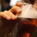 A man drinking a pint of beer in a pub. PIC: Johnny Green/PA Wire