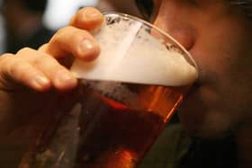 A man drinking a pint of beer in a pub. PIC: Johnny Green/PA Wire