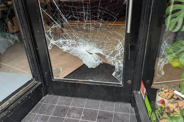 Burglars smashed the door of a Lancaster wine bar and stole a till containing cash from inside.