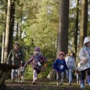 A group of children enjoying a Forestry England Room on the Broom trail