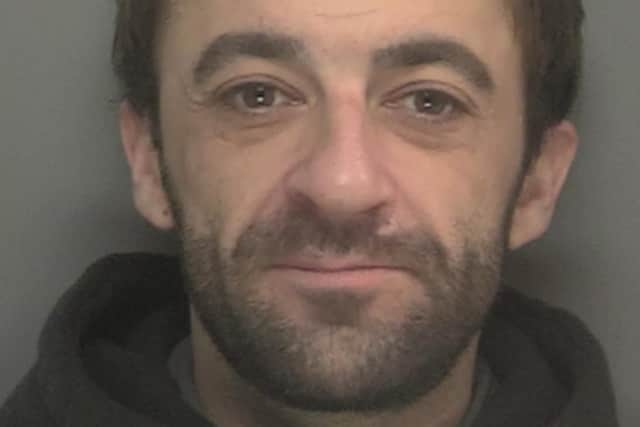 Jack Howard, 32, is wanted by detectives in connection with alleged domestic offences (Credit: Merseyside Police)