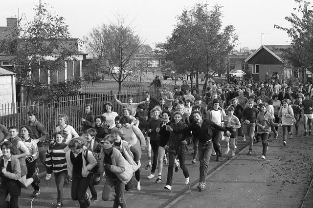 Pupils at Walton-le-Dale High School, Brindle Road, Bamber Bridge, approach the start line for their 12-mile sponsored run and walk to Wheelton clock and back. The 150 boys and girls were set off at intervals in groups of five. All money raised will go to charities for the disabled