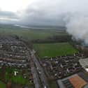 Smoke is still billowing from a large building in Lancaster days after a fire started there. Picture by Gary Watts.