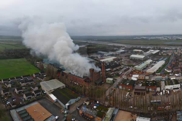 Smoke is still billowing from a large building in Lancaster days after a fire started there. Picture by Gary Watts.