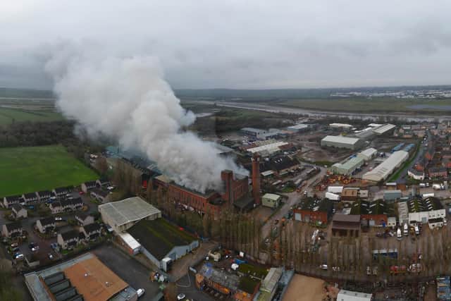 Smoke is still billowing from a large building in Lancaster days after a fire started there. Picture by Gary Watts.