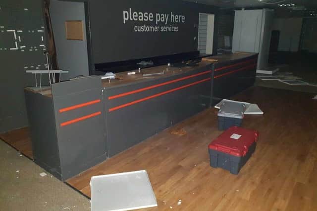 Boxes, allegedly containing snails, stand where shoppers would once have queued at the till (image: Blog Preston)