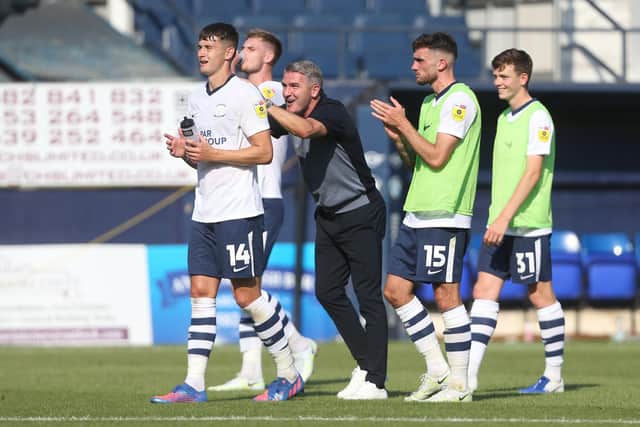 Jordan Storey with Ryan Lowe celebrating after the final whistle at Luton.
