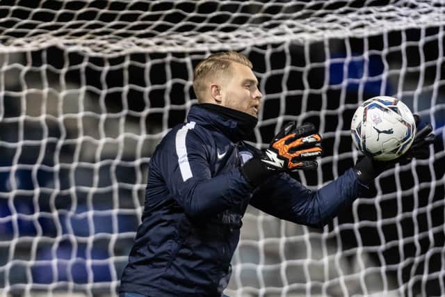 Preston North End goalkeeper Connor Ripley warming up before the game at Luton