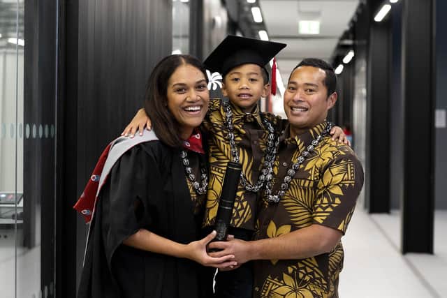 New UCLan graduate Asenaca Baikirewa, with her son Nico and husband Saula.