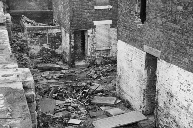 This is the community off Fishergate Hill, Preston in 1977. A blighted landscape caught in a trough between corporation schemes and condemned to further decay for at least five years. These particular buildings were found on Beech Street which was earmarked to make way for the proposed Penwortham by-pass