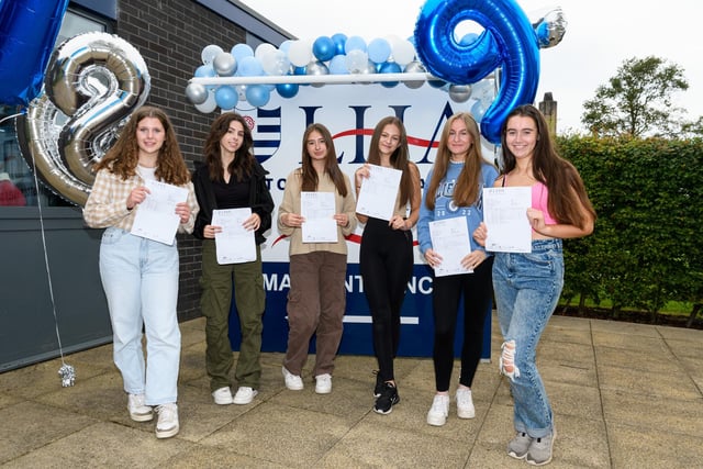 (L-R) Liberty Pierce, Maddie Jones, Grace Bennett, Amy Trumper, Bethan Lally and Kaitlin Ingham celebrate their GCSE results at Lostock Hall Academy.