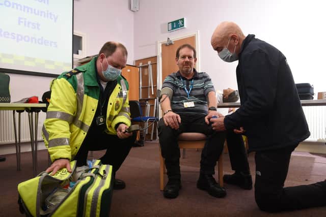 Community First Responders Richie Mitchell and Ken Shaxon with stand-in patient Matthew Semple