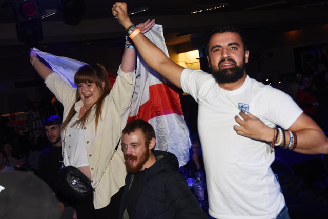 A happy crowd as football fans watch England win 3-0 against Senegal in Round 16 of the World Cup 2022, pictured watching the match at World Cup Fanzone at Riva Showbar, Preston.