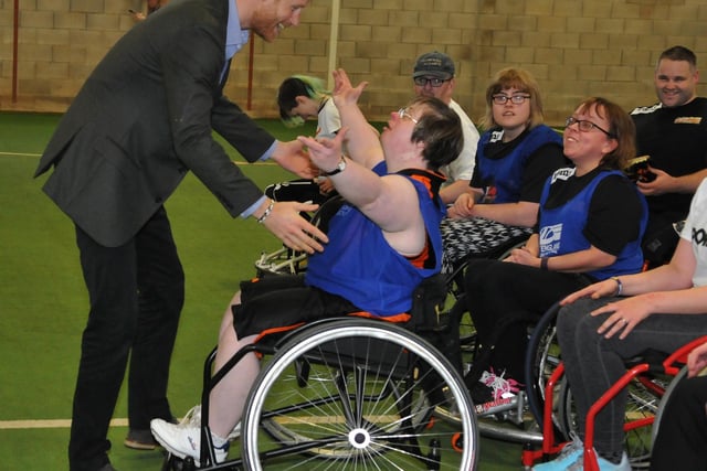 Prince Harry pictured at UCLan Sports Arena giving Helen Gregson a royal hug