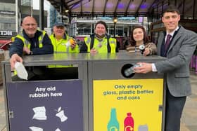 Cllr Freddie Bailey (right), with Ellie Tebbott,  Preston City Council's waste technical officer, and a street cleaning crew with one of the new recycling bins near Market Hall