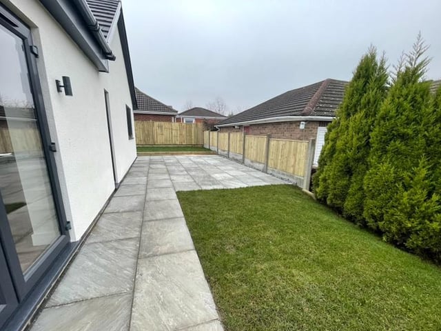 Let's step outside now. This section of the garden is part lawn, part paving, but all fully enclosed.