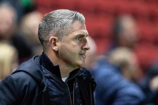 Preston North End's manager Ryan Lowe looks on.