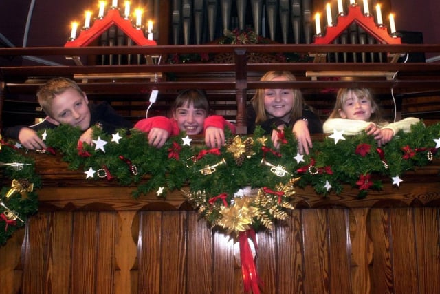 From left, Jack Dawson, eight, Rebecca Cochrane, nine, Jessica Cochcrane, 11, and Bethany Jane Barnesm, seven, helping to decorate the United Reformed Church in Leyland for Christmas
