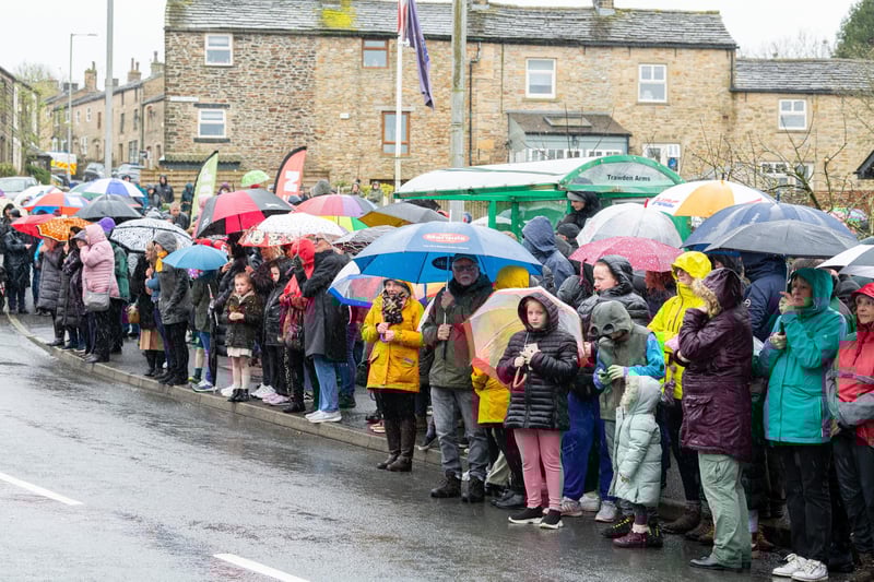 Crowds brave the rain awaiting the arrival of Princess Anne to Trawden. Photo: Kelvin Lister-Stuttard
