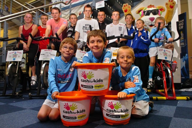 Preston St Theresa's Cats (PST CATS) under eights football team help raise money for Cash 4 Kids with a sponsored spin. Pictured (from left to right): Lewis Sullivan, seven, Liam Thompson, seven, and Tommy Hodson, six