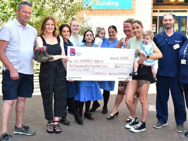 Amy and Hannah present their funds to Bay Hospitals Charity and the teams at Royal Lancaster Infirmary.