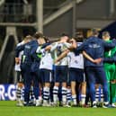 Preston North End players huddle after the match