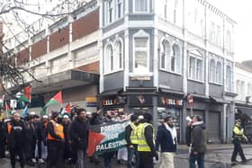 Free Palestine protesters walk down city centre street amid Christmas shoppers