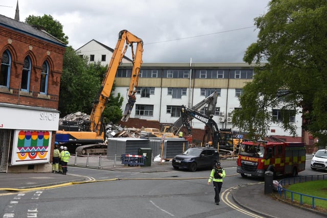 Demolition is currently underway tearing down the two buildings in Preston damaged by a fire on Thursday evening