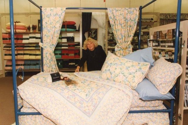 Making the bed is all part of a day's work for Norma Cranwell from the promotions department of Marks & Spencer