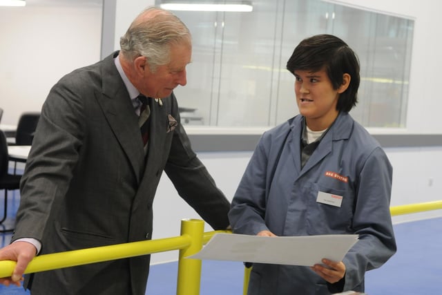 HRH Prince Charles speaks with apprentice Zoe Garstang, right, during his visit to BAE Systems Academy in 2017