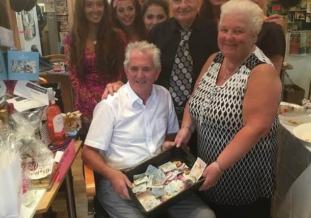 David Woods, back third right, with Len and Babs Curtis (front) from Donnas dream house, and David Maria salon staff. David and his team were big supporters of various charities on the Fylde coast