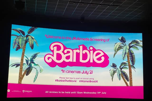 Clare Rawling and her Barbie dolls at the pre-release screen of the Barbie movie.