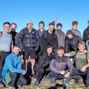 Twins Jacob (front row third from left) and Josh Thornton (fourth from left) with some of the friends who climbed Pendle Hill with them. The brothers are preparing to tackle the National Three Peaks Challenge to raise money for the mental health charity MIND