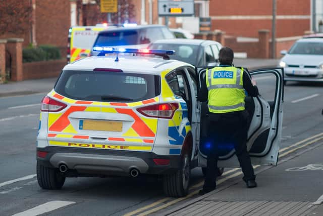 An intruder wearing a motorcycle helmet was detained by a member of the public after smashing a shop window in Preston (Credit: Paul Rushton/ Adobe Stock)