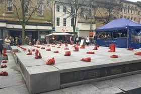 The red shoes installation in Market Square on Saturday, which formed part of the 16 Days of Activism event.