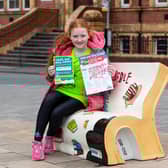 Lara Pritchard (10) on the book bench trail in Chorley as part of the What's Your Story Chorley festival