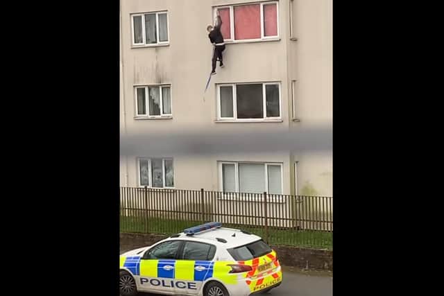 The man, who is reportedly wanted by police, has been dubbed the 'Callon Spider-Man' after he abseiled down a four-storey block of flats on the Callon estate in Preston