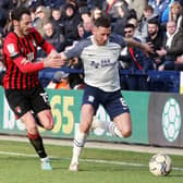 Preston North End's Alan Browne holds off the challenge from Bournemouth's Adam Smith