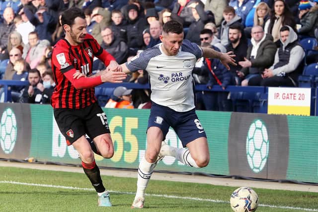 Preston North End's Alan Browne holds off the challenge from Bournemouth's Adam Smith