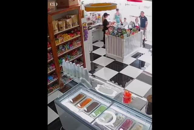The freaky footage was filmed at Lolipops sweet shop in Liverpool Road, Penwortham on Saturday (June 3) and shows a bottle of sauce suddenly falling off the ice cream counter – not just once, or even twice, but four times! – as if pushed by a phantom hand. Credit: Amy and Lauren Elleray-Wilson (Lolipops Sweet Shop)