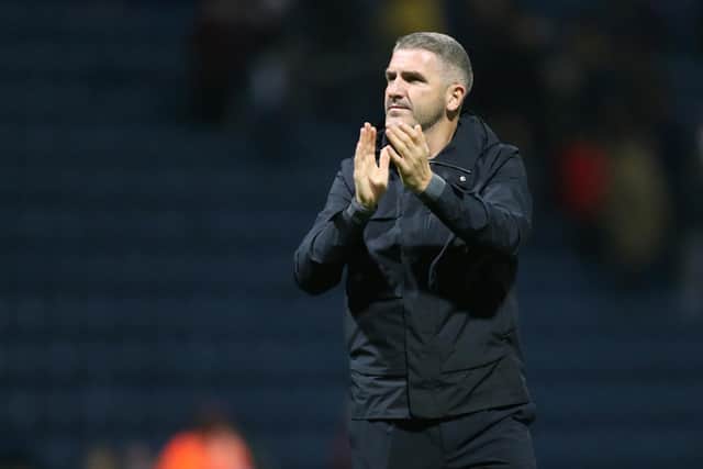 Preston North End manager Ryan Lowe applauds the fans at the final whistle