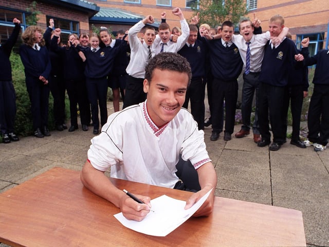Carl Moss, 15, and the Ribbleton Hall High school football team sign the application for the 'Mini World Cup event' in 1999
