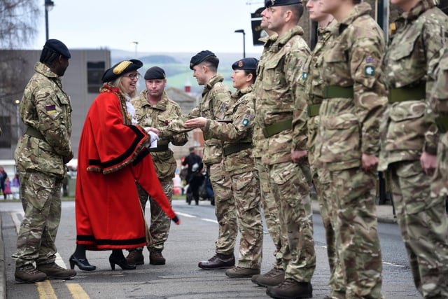 Councillor Julia Berry greets some of the regiment