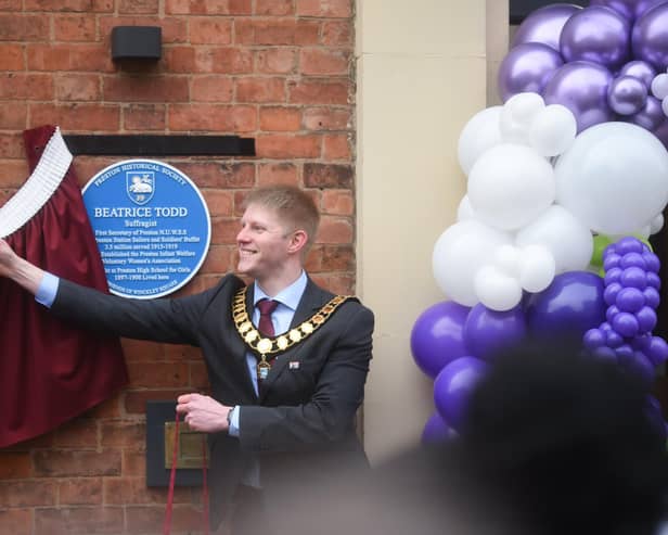 A blue plaque is unveiled by the Mayor of Preston Neil Darby on Starkie Street in Preston dedicated to Beatrice Todd on International Women's Day 2023