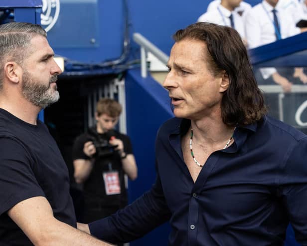 Ryan Lowe is greeted by Gareth Ainsworth