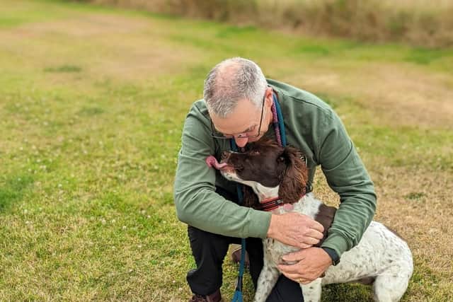 Philip Cooper from Chorley with his late nine-year-old springer spaniel Poppy who was put down on Tuesday after suspected algae poisoning