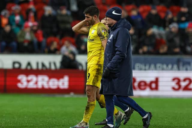 Preston North End's Ched Evans leaves the field injured